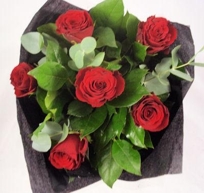 Six red rose hand tied bouquet